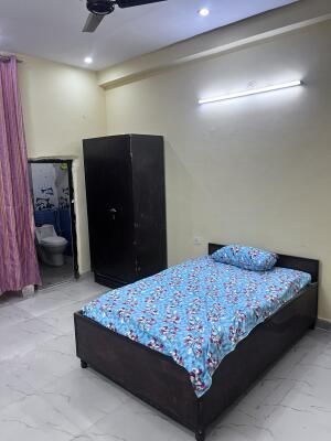 Bedroom with blue floral bedding
